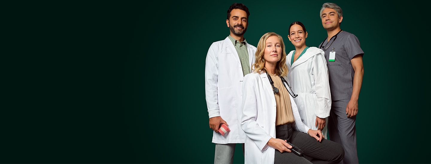 Health care professionals posing in uniform.